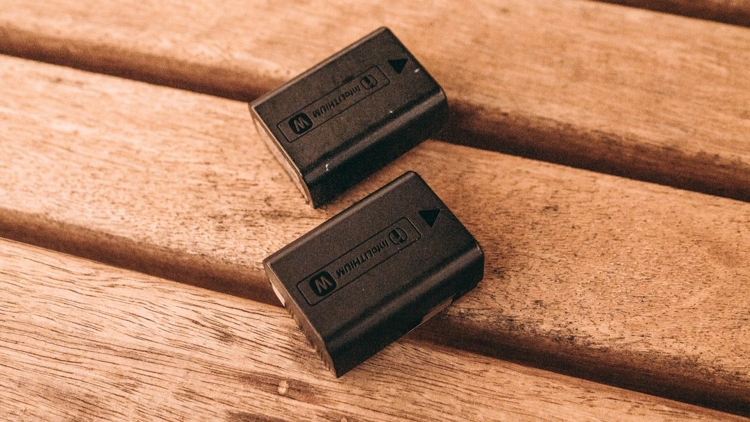 a couple of batteries sitting on top of a wooden bench