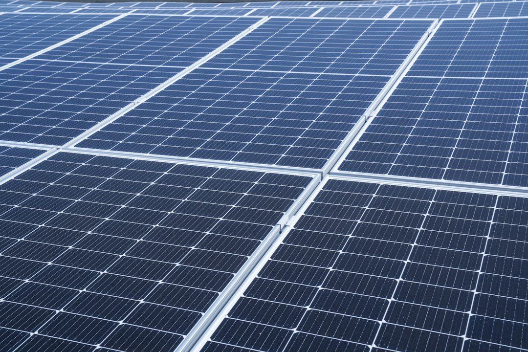 a large array of solar panels on the roof of a building